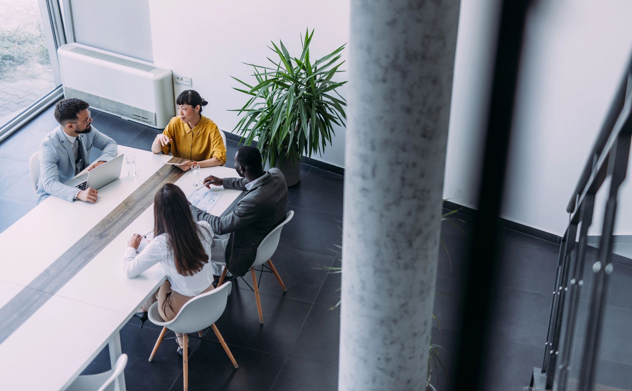 Group of business professionals in a collaborative office meeting