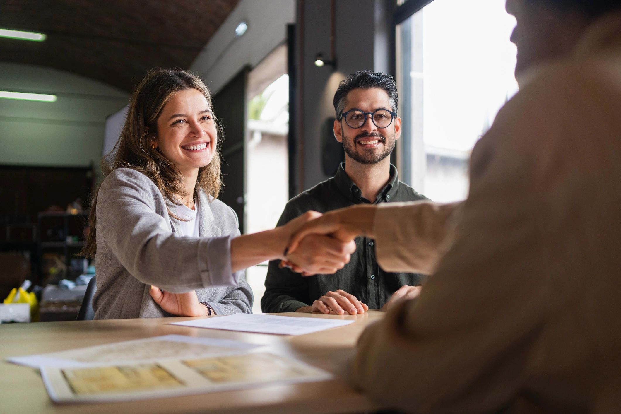 Business partners shaking hands after a successful agreement
